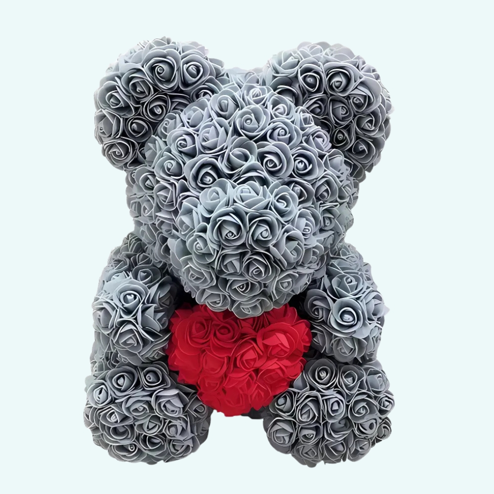 Teddy bear grey roses collector's box on a light blue background.