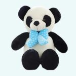 Giant panda plush on a light blue background.