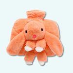 Rabbit plush boiler orange on a light blue background.