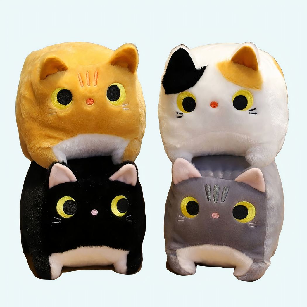 Square Cat Plush Four square cat plush toys on a wooden table. A yellow cat on a black cat and a white cat on a grey cat.