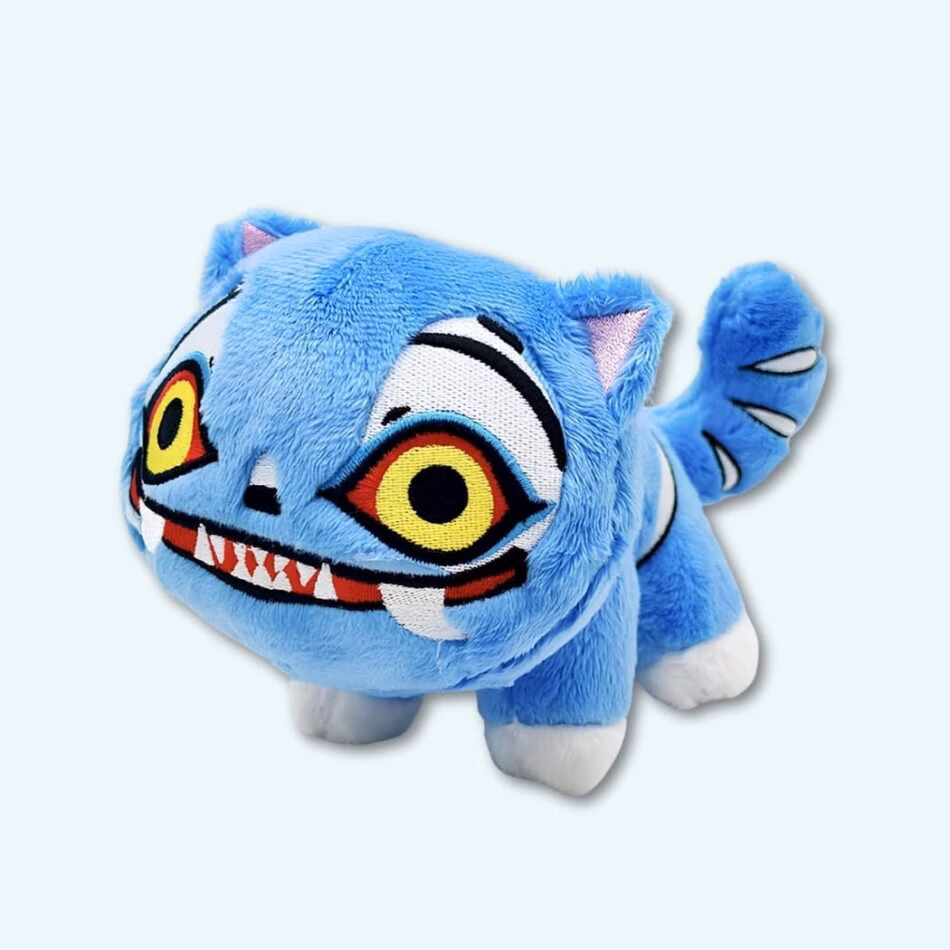 Img_09_2025_Peluche_Kpop_Demon_Hunters_Tigre_Farfelu_1-950X950.Jpg K-pop Demon Hunters plush funny blue tiger with yellow eyes. On a sky blue background.