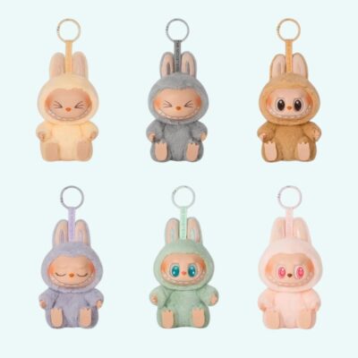 Labubu style plushies in sitting position on sky blue background